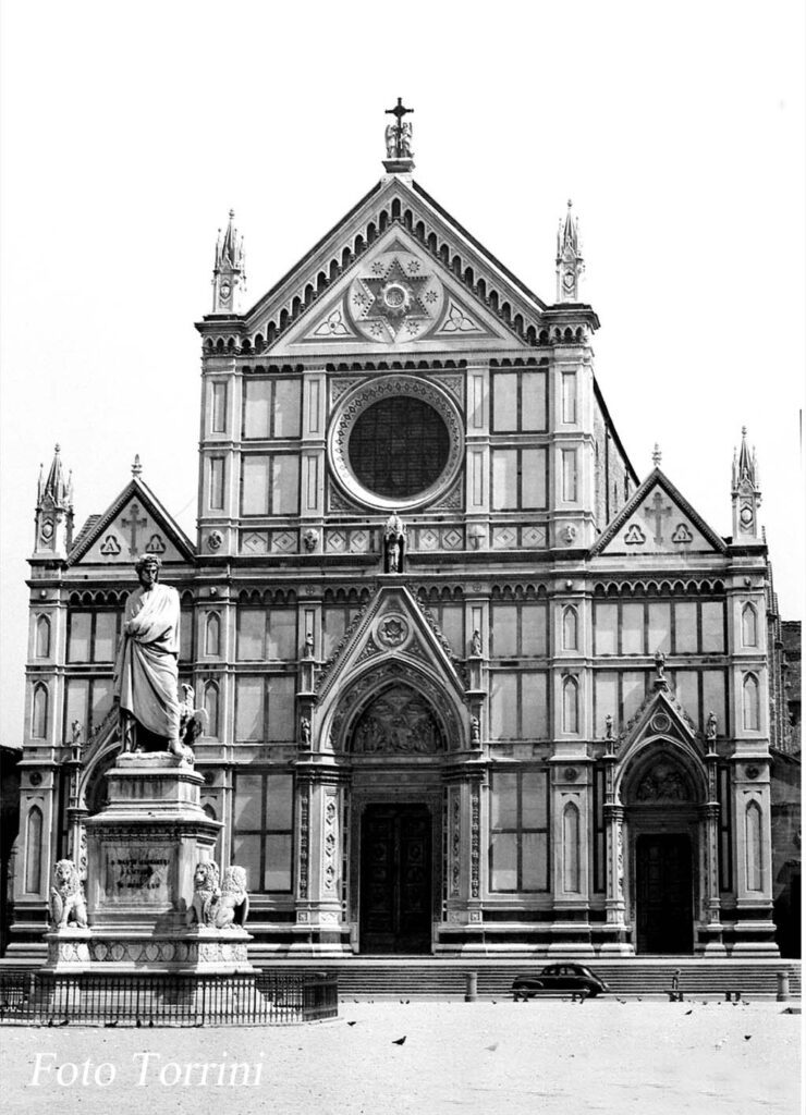 A black and white photo of an old church.